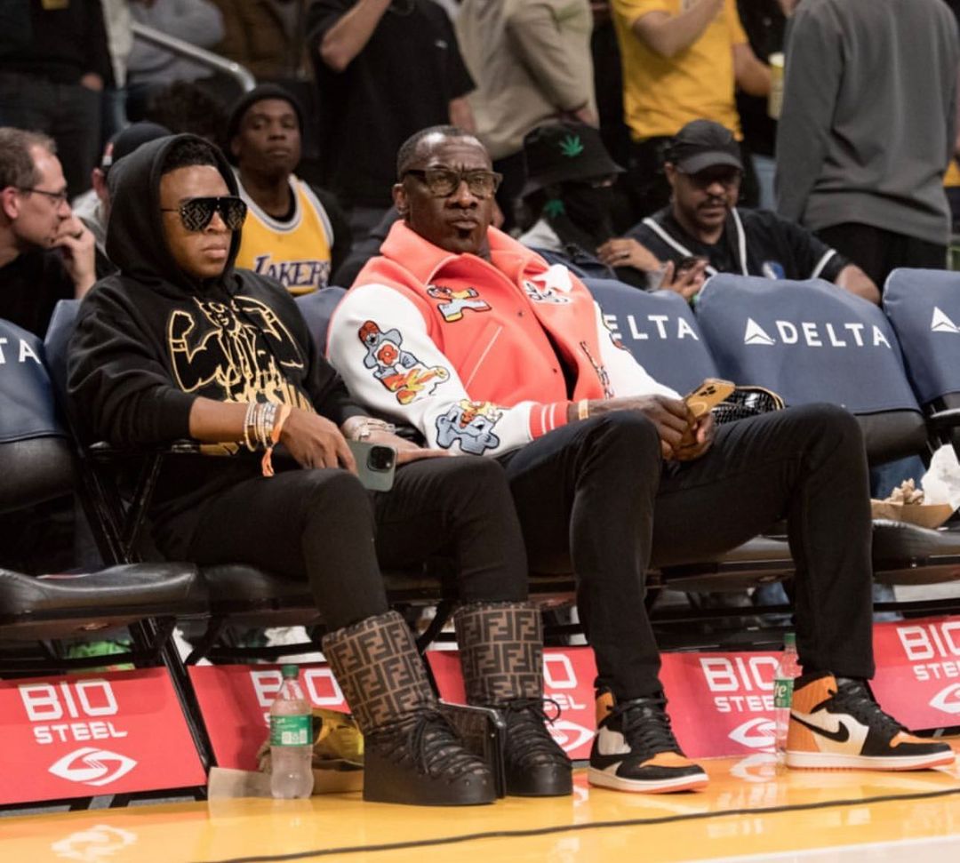 Shannon Sharpe Sits Courtside in a Louis Vuitton Varsity Jacket