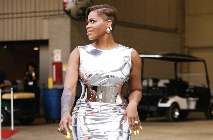 Fantasia Wore a Corseted Dolce and Gabbana Chrome Midi Dress to ESSENCE Fest