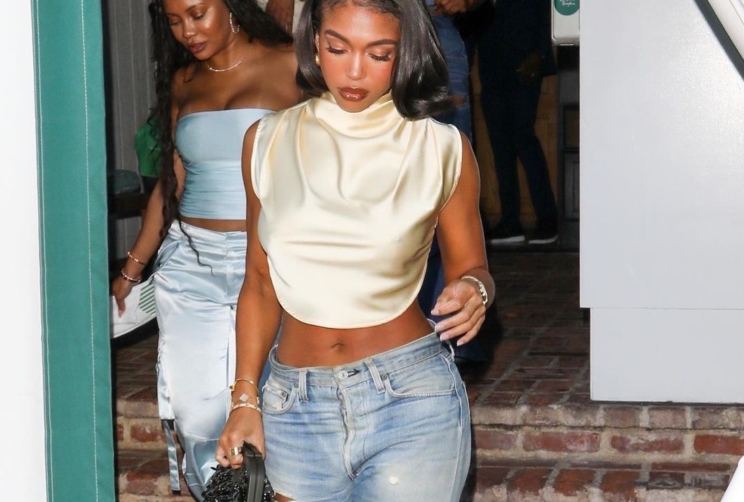 Lori Harvey Grabs Dinner in a Pretty Little Thing Butter Cream Crop Top, Levis Jeans, and Balenciaga Bomb Accessories!