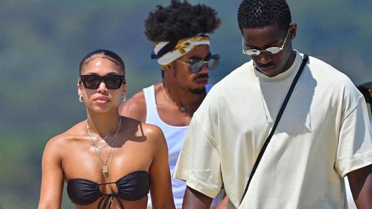 Lori Harvey Wore a Black Melissa Simone Bikini with an Abstract Hermes Cover-Up with Beau Damson Idris